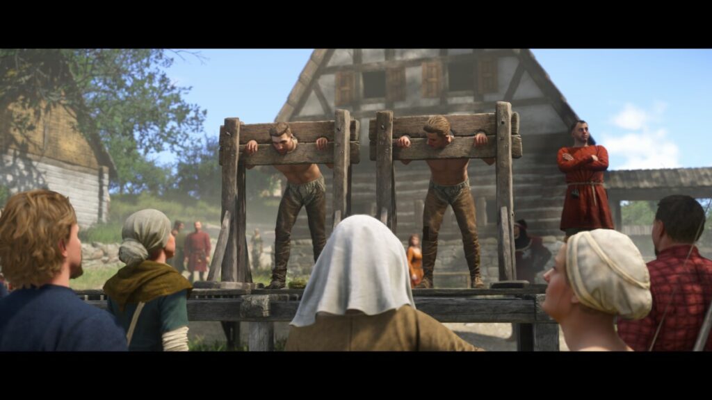 Kingdom Come: Deliverance 2 — крестьяне в колодках на деревенской площади